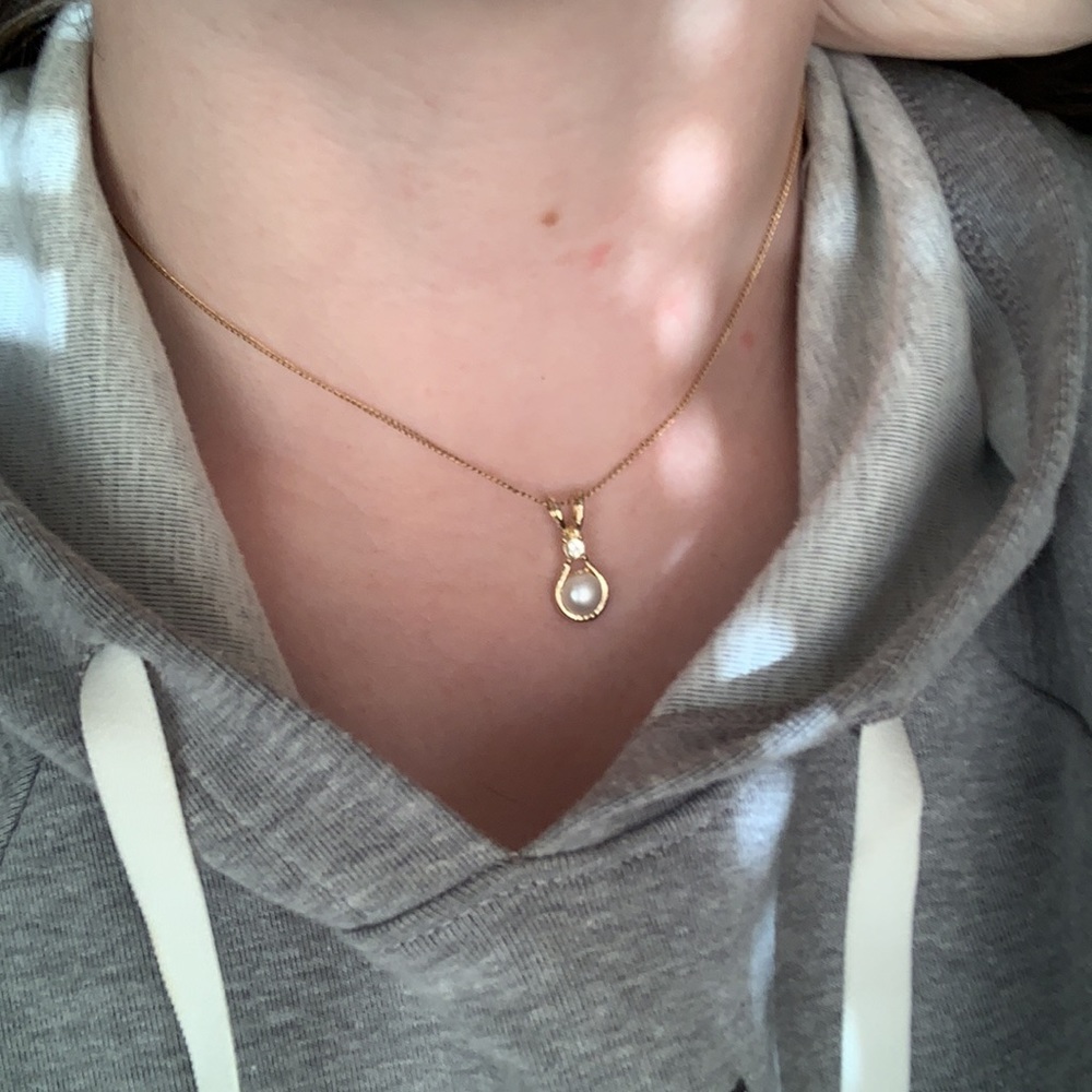 Gold and pearl necklace charm